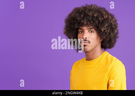 Serious african with curly hair man looking at camera Stock Photo