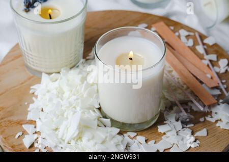 Close up of white soy wax flakes for candle making. Light texture of soy  wax flakes. Ingredient for homemade candles. Ecological lifestyle Photos