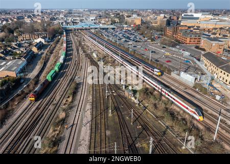 Aerial cityscape view of LNER and freight trains arriving and departing from Peterborough Railway Station on the East Coast Main line Stock Photo