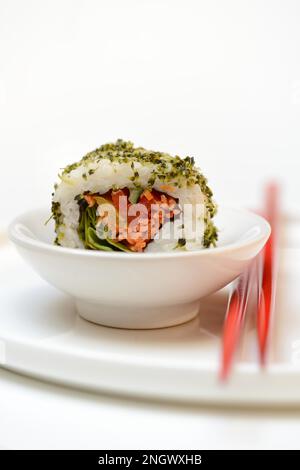 Vegetarian sushi in bowls and chopsticks Stock Photo