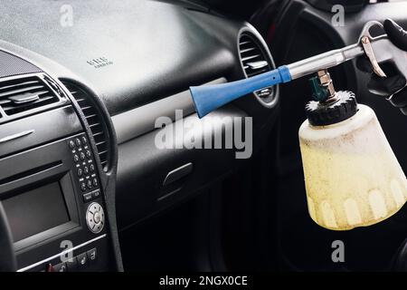 close up person cleaning car interior Stock Photo