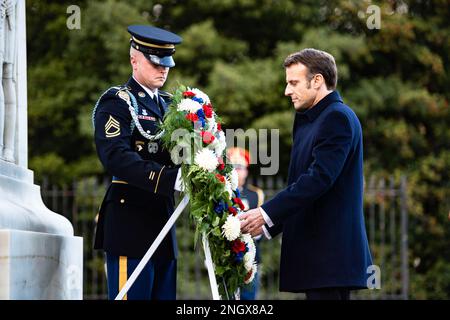 French President Emmanuel Macron participates in a wreath-laying ceremony at the Tomb of the Unknown Soldier at Arlington National Cemetery, Arlington, Virginia, Nov. 30, 2022.  While at ANC, President Macron and his wife, Brigitte, also placed roses at the gravesite of Pierre Charles L’Enfant. Born in Paris in 1754, L’Enfant left to fight in the American Revolution. Afterwards, he was appointed by President George Washington to plan the new “federal city” that would be the new nation’s capital – Washington, D.C. Stock Photo