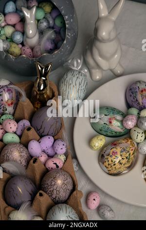 photo decorative eggs of different shapes and colors and a rabbit Stock Photo
