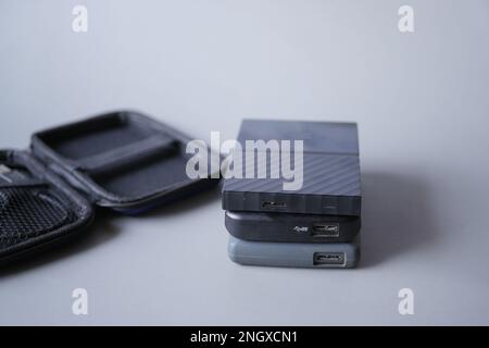 stack of external hard drives on table  Stock Photo