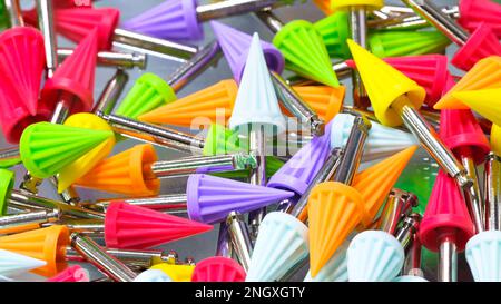 Many dental tools drills different colors close-up, dentistry concept background Stock Photo