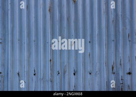 Close-up of a rustic corrugated iron wall cladding background Stock Photo