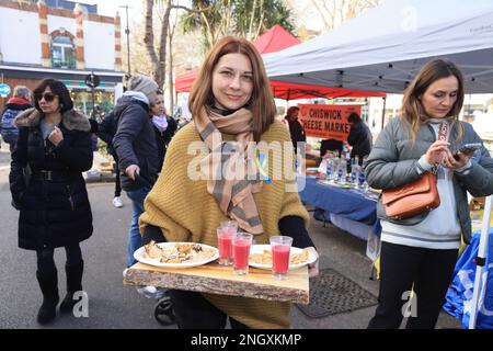 Chiswick monthly cheese market, this week with A Taste of Ukraine and Ukrainian music as the one year anniversary of the start of the Russian invasion approaches. Money was raised to support the ongoing crisis, supporting British-Ukrainan Aid and First Aid Ukraine, in west London, UK Stock Photo