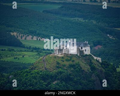 Aerial shot of the white stone fortress castle of Fuzer (Füzér), Hungary on top of a mountain Stock Photo
