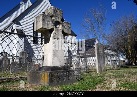 The historic cemetery behind the Holy Trinity Episcopal Church, founded in 1848,  in rural Hertford, North Carolina. Stock Photo