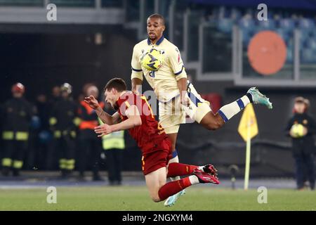 Rome, Italy. 19th Feb, 2023. Andrea Belotti, left, of AS Roma, is fouled by Isak Hien, of Hellas Verona, during the Serie A football match between Roma and Hellas Verona at Rome's Olympic stadium, Rome, Italy, February 19, 2023. Credit: Riccardo De Luca - Update Images/Alamy Live News Stock Photo