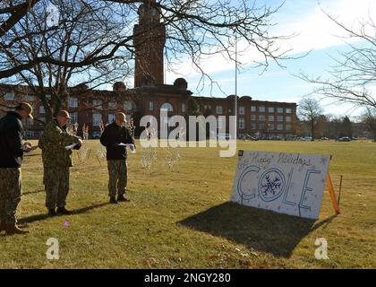 GREAT LAKES, Il. (Dec. 1, 2022) The Naval Station Great Lakes leadership team judges this year’s holiday cards during the annual Morale, Welfare and Recreation sponsored contest on Ross Field. Stock Photo