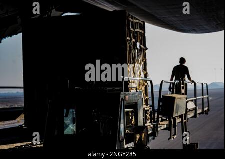 5 Galaxy Rear Ramp An airman marshals a C-5 Galaxy cargo aircraft through a crowded ...