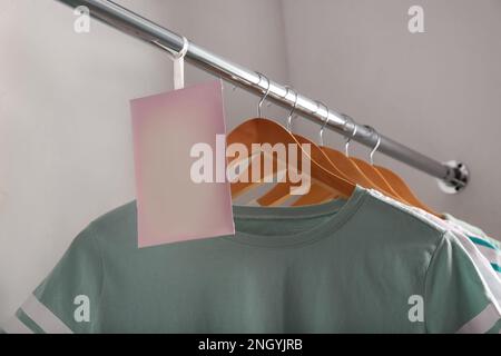 Scented sachet with flowers and stylish clothes on hanger Stock Photo -  Alamy