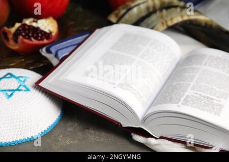 Composition with Rosh Hashanah holiday symbols on grey table, closeup Stock Photo