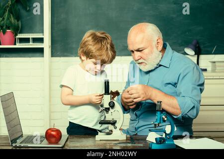 Teacher is skilled leader. Grandfather and grandchild. Concept of a retirement age. Learning and education concept. Grandfather and grandson. Stock Photo