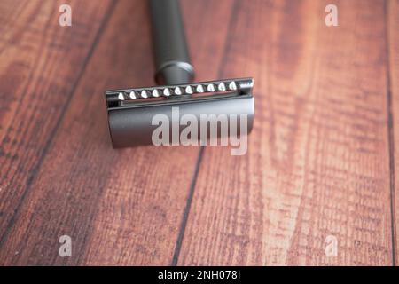 Safety razor on a wood table background Stock Photo - Alamy