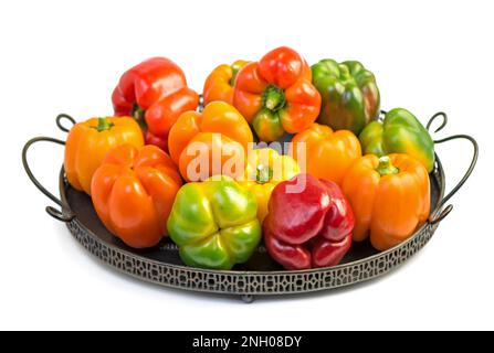 colored peppers over white background Stock Photo