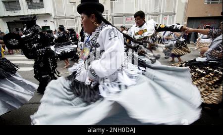 Sao Paulo, Brazil. 19th Feb, 2023. Bolivians Revelers dancing during the annual street block party know as 'Bolivian Carnival' Eon the third day of Carnival on February 19, 2023 in Sao Paulo, Brazil. According to the São Paulo City Council, during Carnival week more than 500 street blocks (blocos de rua) are held and more than 15 million people are expected to participate in them. Credit: Cris Faga/Alamy Live News Stock Photo