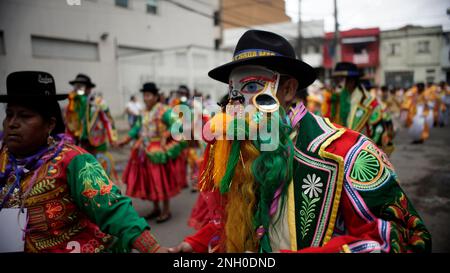 Sao Paulo, Brazil. 19th Feb, 2023. Bolivians Revelers dancing during the annual street block party know as 'Bolivian Carnival' Eon the third day of Carnival on February 19, 2023 in Sao Paulo, Brazil. According to the São Paulo City Council, during Carnival week more than 500 street blocks (blocos de rua) are held and more than 15 million people are expected to participate in them. Credit: Cris Faga/Alamy Live News Stock Photo