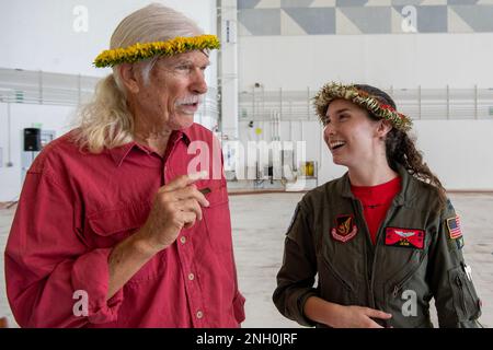 Bruce Best, University of Guam researcher and Capt. Jenn Brenton, 36th Expeditionary Airlift Squadron Operation Christmas Drop deputy mission commander, talk after the Operation Christmas Drop push ceremony at Andersen Air Force Base, Guam, Dec. 5, 2022. Brother Bruce has been providing support for Operation Christmas Drop as a volunteer island liaison and radio operator over 40 years. Stock Photo