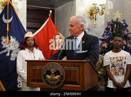 U.S Army Maj. Gen. Van McCarty, South Carolina adjutant general, joins Governor Henry McMaster, representatives of the Gold Star Mothers association and families of South Carolina National Guard’s fallen service members in conducting a “Tree for the Fallen” lighting and dedication ceremony at the State House in Columbia, South Carolina, Dec. 5, 2022. The tree will be on display at the state house throughout the holidays as a tribute to all South Carolina’s fallen service members. Stock Photo
