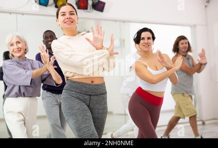 Group of people practicing energetic lindy hop movements Stock Photo