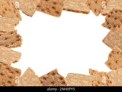 Frame of fresh crunchy rye crispbreads on white background, space for text Stock Photo