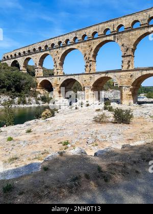 Three-tiered aqueduct Pont du Gard bridge in provence natural park Stock Photo