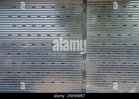 Detail of old steel metal shutter and folding door gate in Chinese style Stock Photo