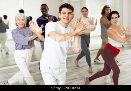 Group of people practicing energetic lindy hop movements Stock Photo