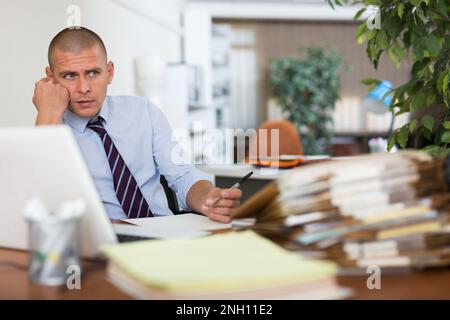 Angry male manager experiencing emotions in office Stock Photo