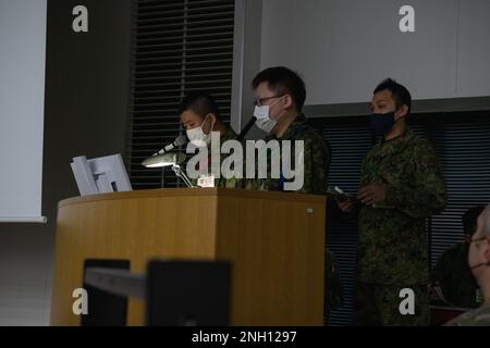 Japan Ground Self-Defense Force members provide a situation update to U.S. personnel and members of the Japan Self Defense Forces during a briefing at Exercise Yama Sakura 83 at Camp Asaka, Japan, Dec. 6, 2022. As a part of U.S. Army Pacific Operation Pathways, Yama Sakura 83 is the largest and most complex U.S. Army and Japan Ground Self-Defense Force bilateral command post exercise to date. (Proprietary information redacted) Stock Photo