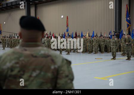 U.S. Army Command Sgt. Maj. Albert Serrano, the command sergeant major of the 1st Combat Aviation Brigade, 1st Infantry Division, leads the formation in reciting the Long Motto Call during a relinquishment of responsibility ceremony at Marshall Air Field on Fort Riley, Kansas, Dec. 6, 2022. The call is an expansion of the division’s motto, “No mission too difficult, no sacrifice too great–Duty First!” which is typically led by the outgoing leadership as a final act in the organization. Stock Photo