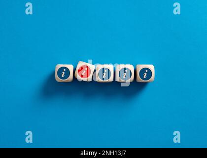 False information. Fake news and deception. Information symbols on wooden cubes. Stock Photo