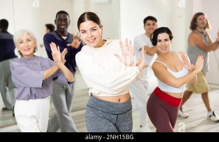 Group of people practicing energetic lindy hop movements Stock Photo