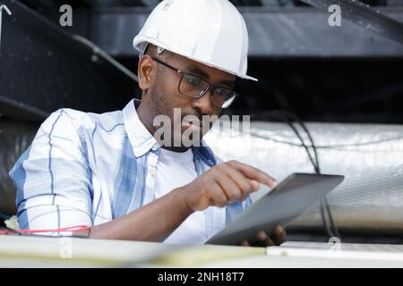 electrical engineer using a tablet Stock Photo