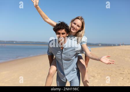 young couple having fun on the beach Stock Photo