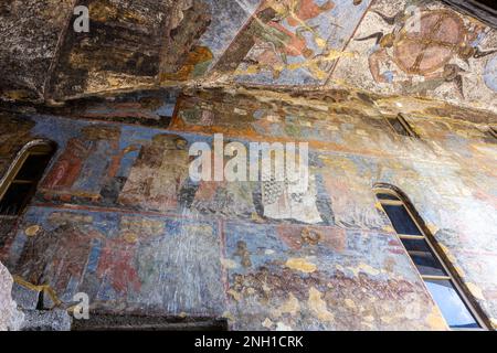 Church of Dormition with colorful medieval frescos in Vardzia cave monastery complex, Georgia. Inside view of stone chapel. Stock Photo