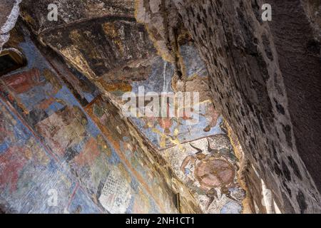 Church of Dormition with colorful medieval frescos in Vardzia cave monastery complex, Georgia. Inside view of stone chapel. Stock Photo