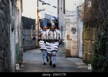 Verin, Ourense, Galicia, Spain. 19th Feb, 2023. During the ''Entroido'' festivities, as the carnival in Galicia is called, the Cigarrones, characters with traditional costumes and masks, enliven the streets while music and people in costumes pass by. February 19, 2022. Verin, Galicia, Spain. (Photo by Cristian Leyva/NurPhoto)0 Credit: NurPhoto SRL/Alamy Live News Stock Photo