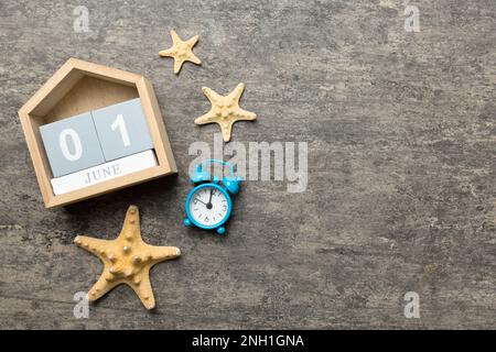 June 1th. Image of june 1 wooden calendar on colored background. Summer day. Empty space for text. Stock Photo