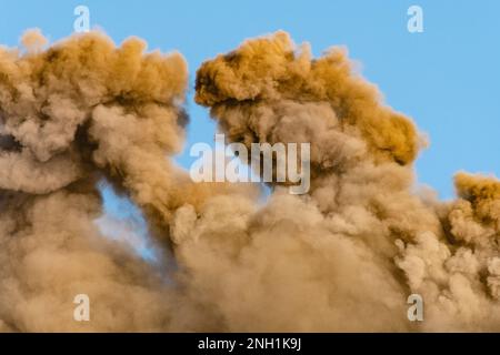 Vast clouds of volcanic ash and toxic gas pouring from the south-east crater of Mount Etna, Sicily, following a small eruption Stock Photo