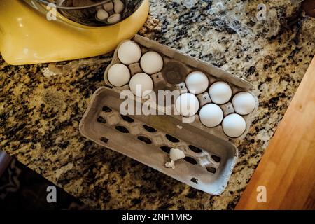 Carton of White Chicken Eggs on Granite Counter Next to Kitchen Mixer Stock Photo