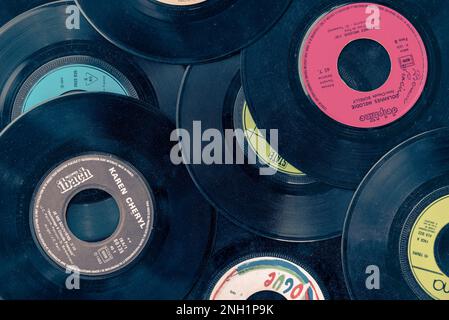 Collection of old colorful vinyl records, vintage music background Stock Photo