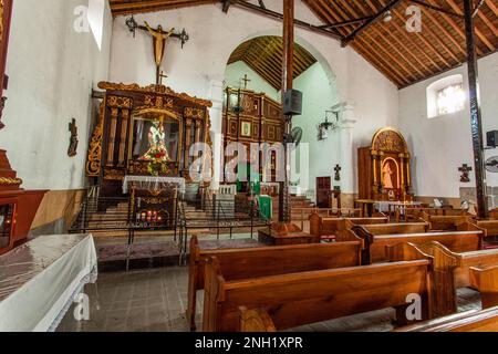 The interior of the Church of San Felipe or Church of the Black Christ in Portobelo, Panama.  The church is famous for its statue of a Black Christ, a Stock Photo