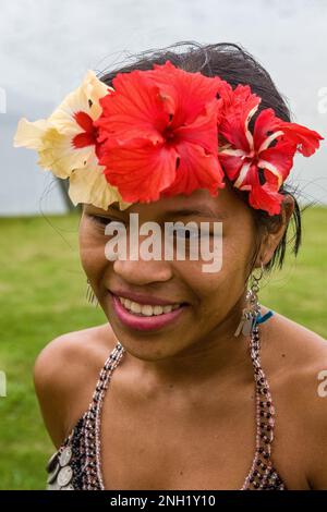 An indigenous Embera woman dressed up for visitors in her village on Lake Alejuela in Panama.  The women's tops are beaded and often decorated with si Stock Photo