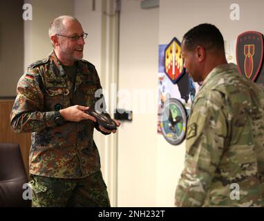 Col. Stephan Saalow (left), the commander of the German CBRN Defense Command, presents a plaque to Brig. Gen. Daryl O. Hood (right), the commanding general of the 20th Chemical, Biological, Radiological, Nuclear, Explosives (CBRNE) Command, Dec. 7.  The two commanders exchanged command briefs and discussed training exercises that support building partnership capacity opportunities. U.S. Army photo by Marshall R. Mason. Stock Photo