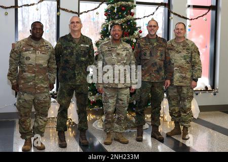 (From the left) Command Chief Warrant Jesse Deberry, Lt. Col. Mario Gobel, Brig. Gen. Daryl O. Hood, Col. Stephan Saalow and Col. Brant D. Hoskins stand together in the 20th Chemical, Biological, Radiological, Nuclear, Explosives (CBRNE) Command Headquarters Atrium, Dec. 7.  The two commands exchanged command briefs and discussed training exercises that support building partnership capacity opportunities.  U.S. Army photo by Marshall R. Mason. Stock Photo