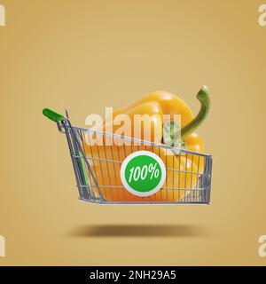 Flying shopping cart with fresh bell pepper, organic vegetables and grocery shopping concept Stock Photo