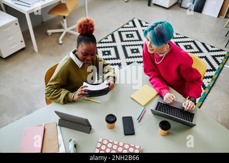 Top view at two creative young people developing VR software in office Stock Photo